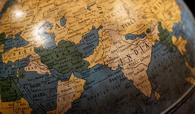 Close-up of a vintage globe highlighting India